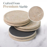 Set of marble coasters with a close-up detail on a marble surface.